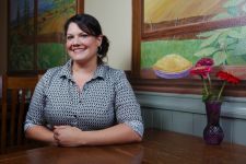 Rockne Roll // DYV
Owner Nora Lamb poses at a table in The Crescent Café.